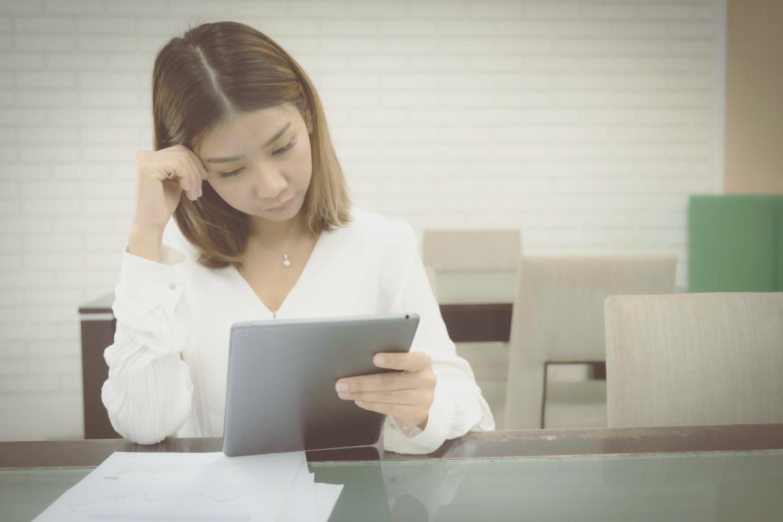 Business professional reviewing cash flow reports and financial documents